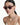 lady wearing Swarovski glasses, earrings, and many necklaces