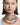 young lady wearing many layers of Swarovski millenia necklaces in different colours